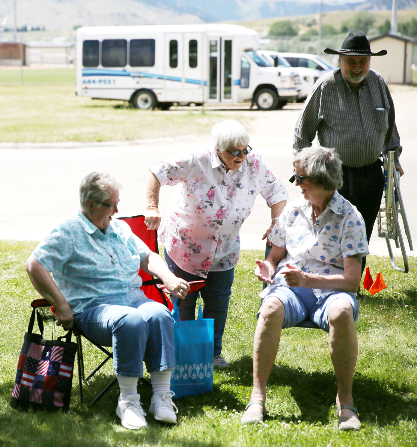 Zola Werle, center, greets friends Alice Ott, left, and Connie Norton